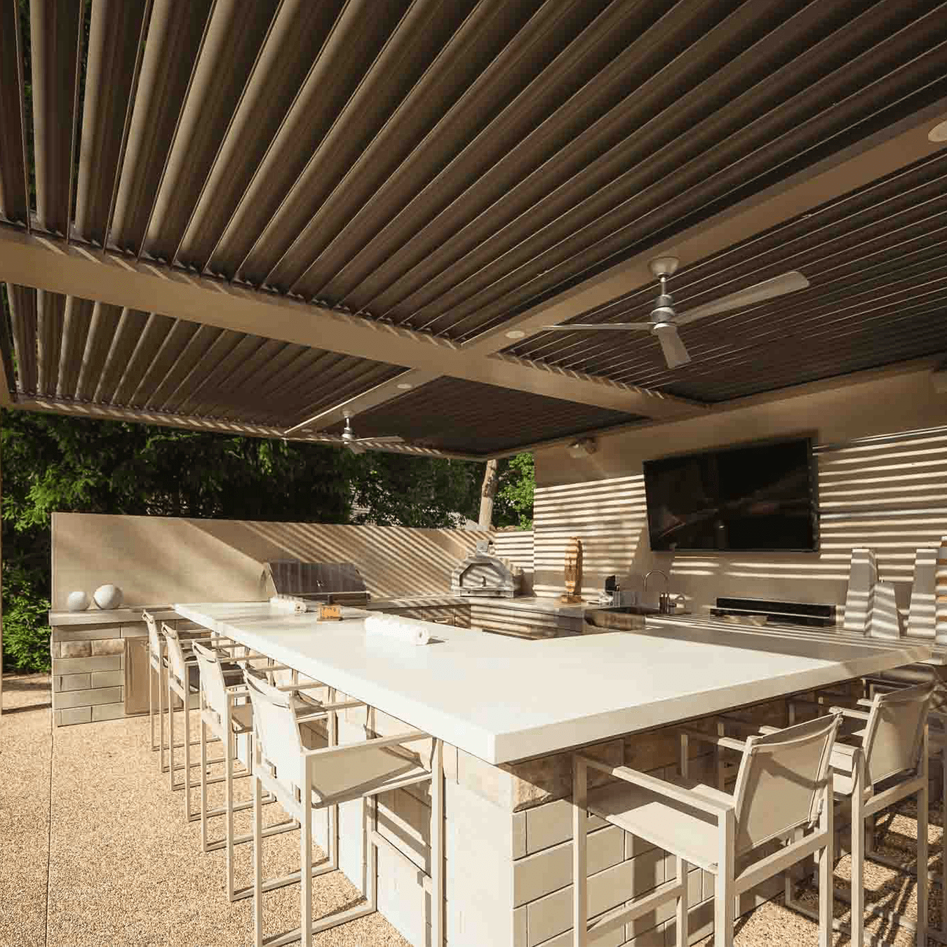completed StruXure pergola covering outdoor kitchen in Bloomfield Hills