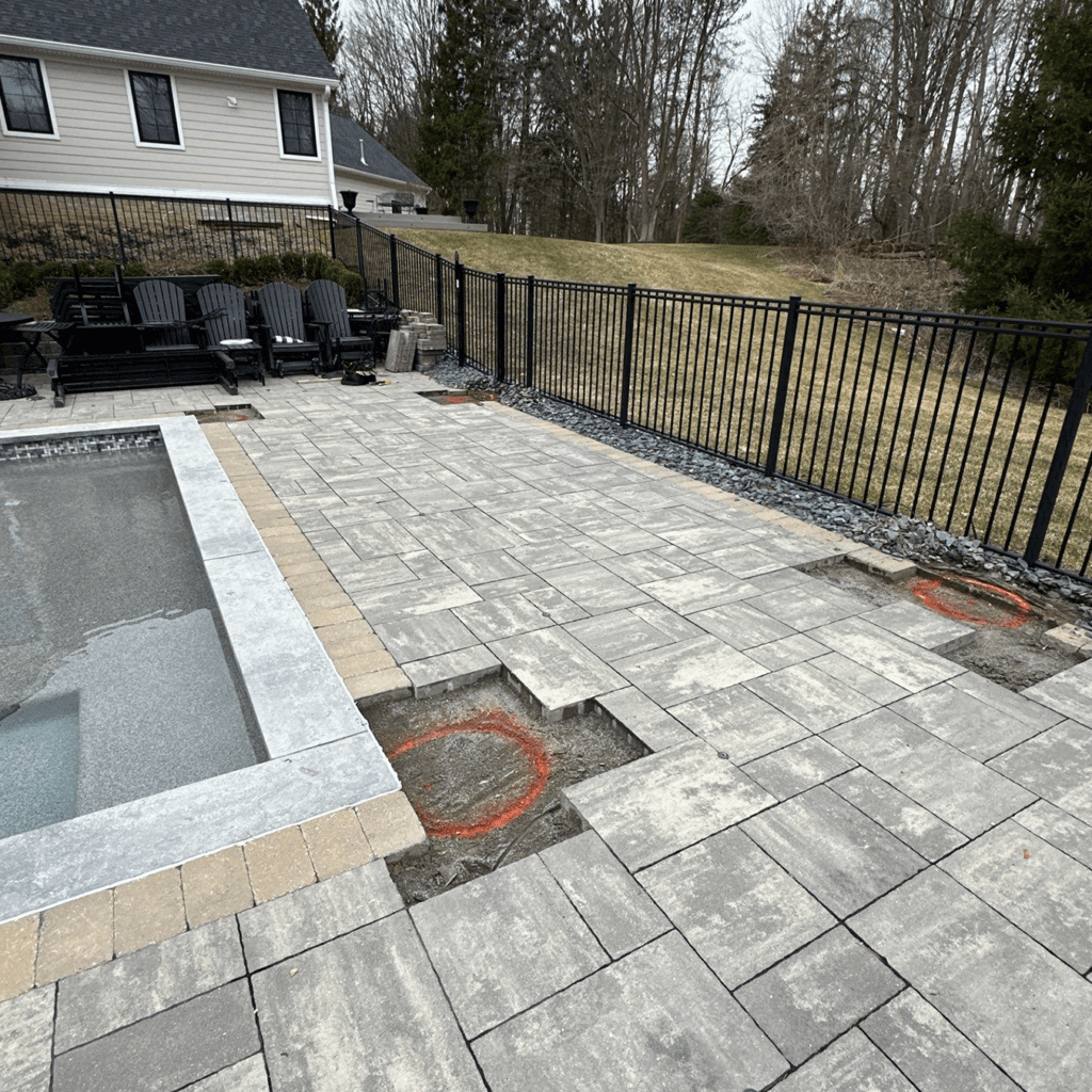 backyard pool area before pergola installation in Northville Michigan