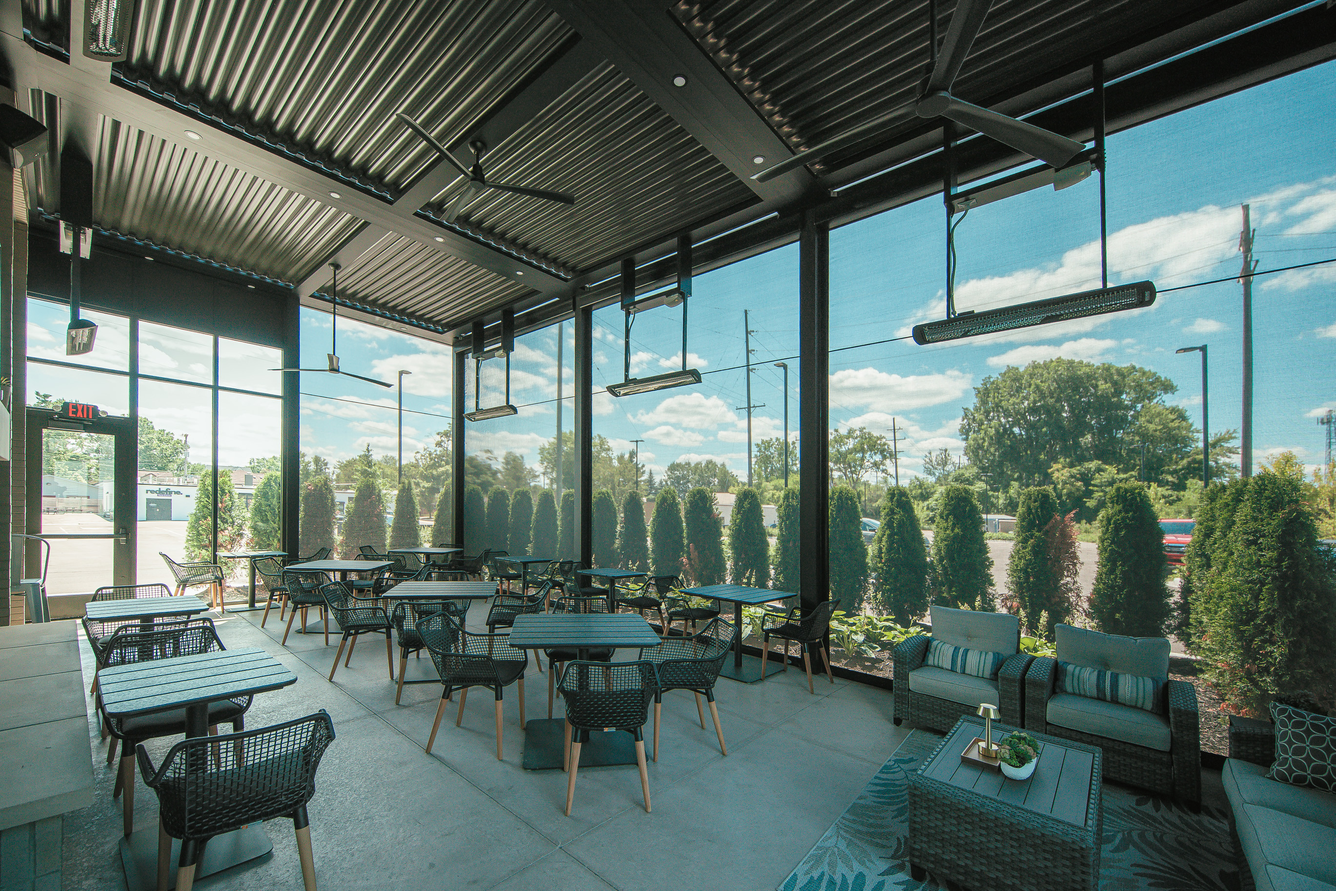 StruXure louvered pergola with MagnaTrack motorized screens at Chicane restaurant in Downtown Plymouth MI by Skyview Detroit