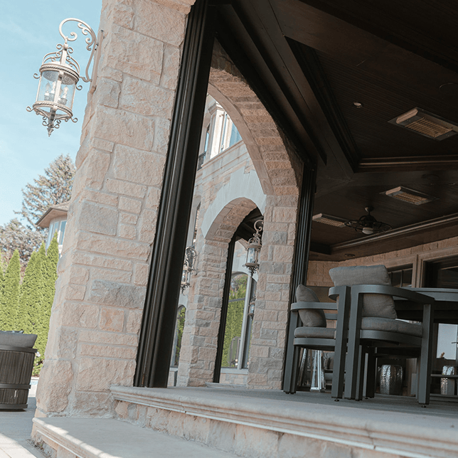 Dual motorized screens on luxury home lakefront in West Bloomfield MI built by Skyview Detroit
