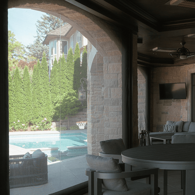 Dual motorized screens on luxury home lakefront in West Bloomfield MI built by Skyview Detroit