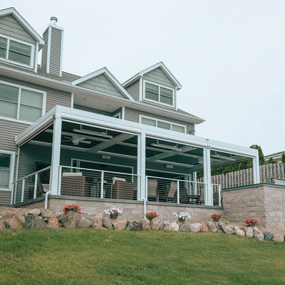 Fully equipped StruXure louvered pergola with outdoor kitchen and motorized screens in Chelsea MI by Skyview Detroit