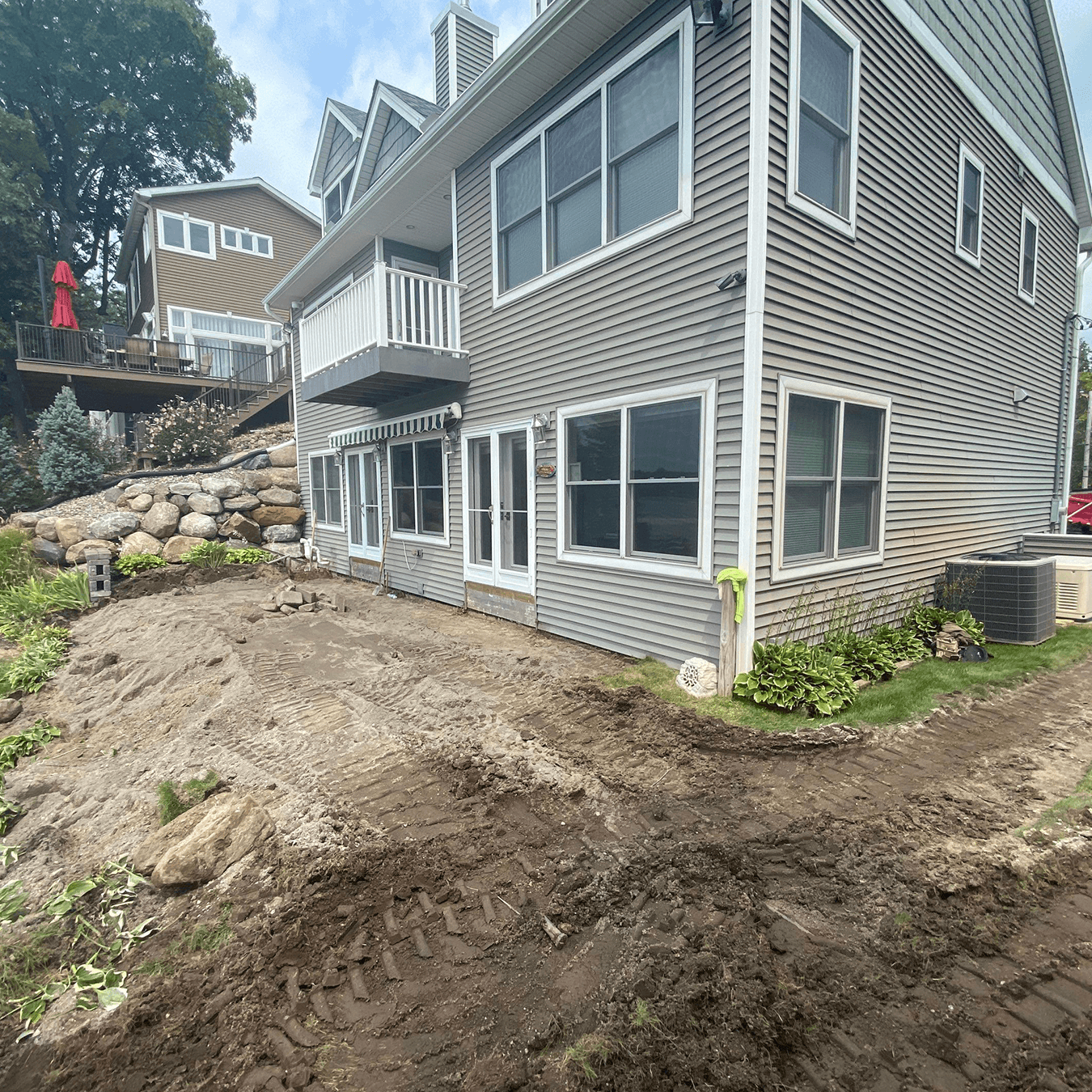 before construction on this Chelsea MI lakefront outdoor space