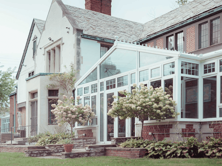 historic home in Grosse Pointe MI with two glass conservatories
