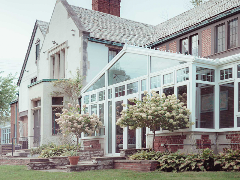 historic home in Grosse Pointe MI with two glass conservatories