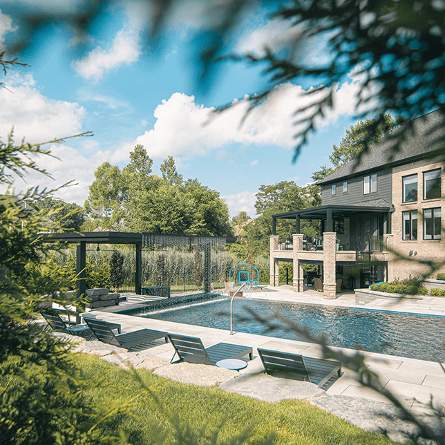 luxury backyard pool with StruXure pergola and seating area
