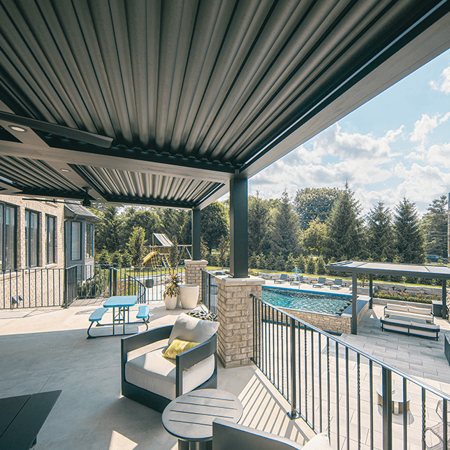 luxury backyard pool with StruXure pergola and seating area