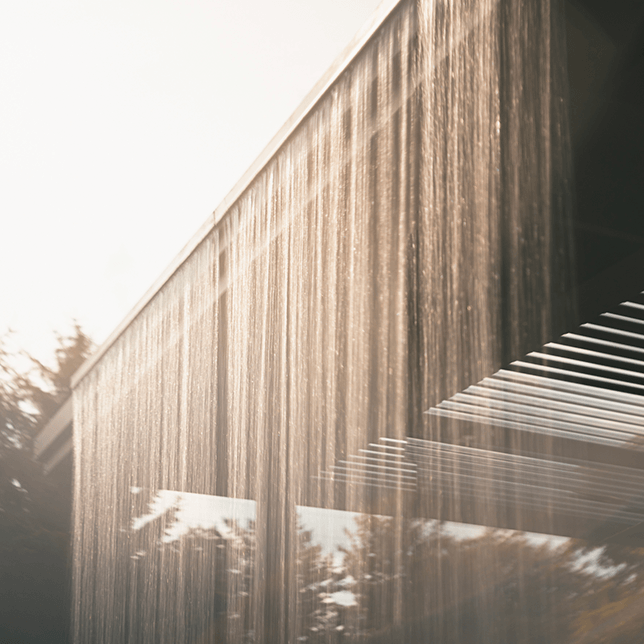 custom rainwater feature integrated into poolside pergola