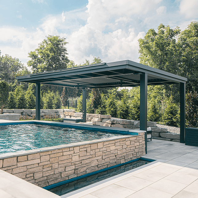 custom rainwater feature integrated into poolside pergola