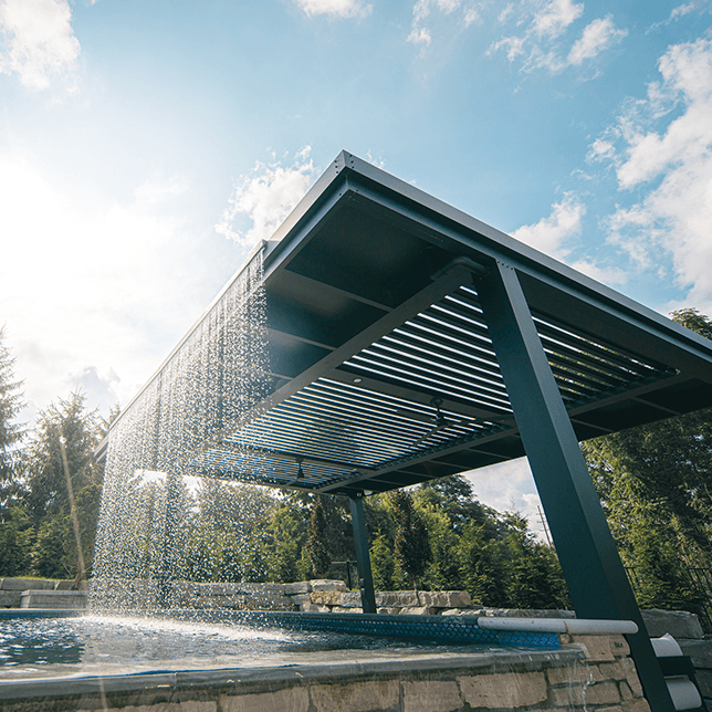 custom rainwater feature integrated into poolside pergola