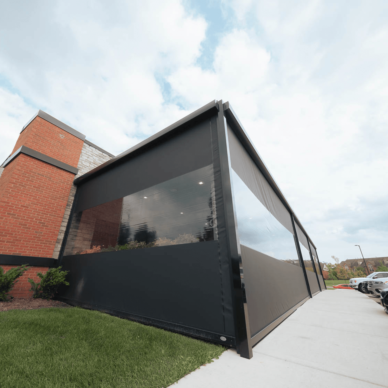 MagnaTrack vinyl screens enclosing covered patio at restaurant in Northville Township Michigan
