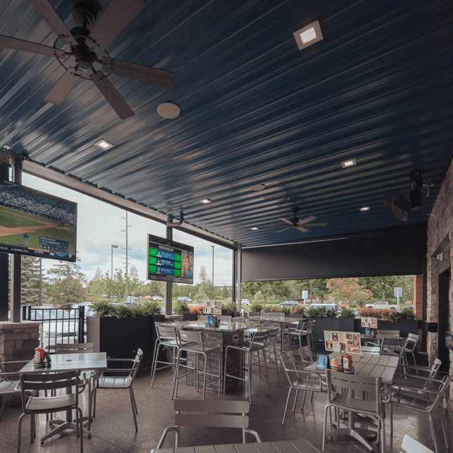 restaurant patio enclosed with MagnaTrack vinyl screens in Northville Township Michigan