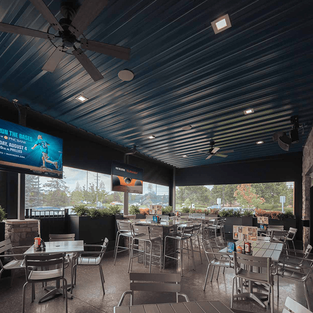 restaurant patio enclosed with MagnaTrack vinyl screens in Northville Township Michigan