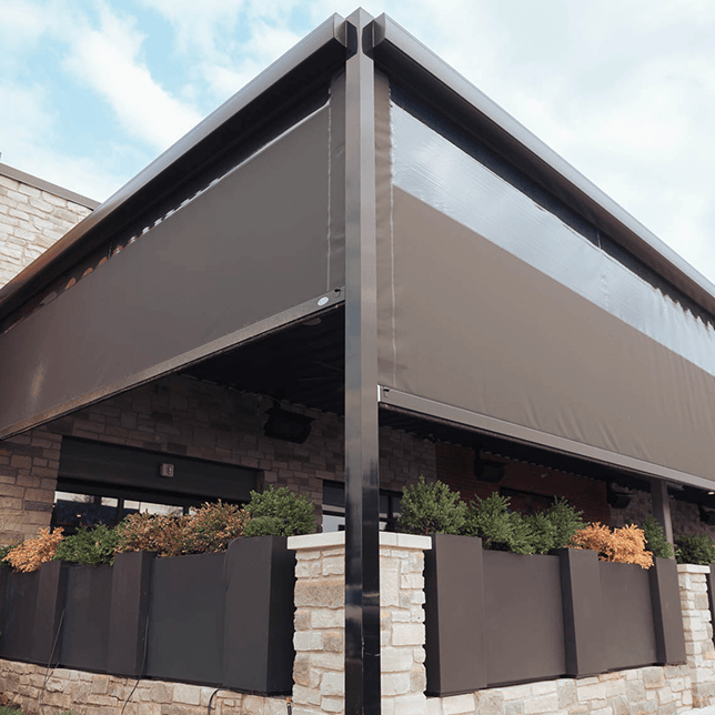 restaurant patio with sun-blocking screen borders during evening hours