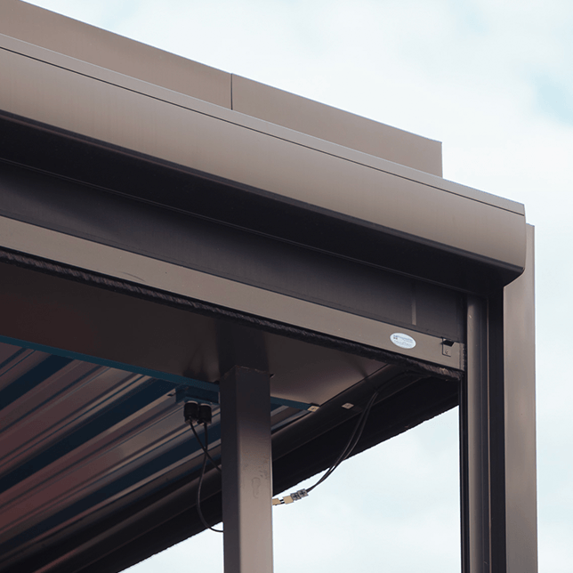 outdoor dining area with clear vinyl screens and overhead heaters