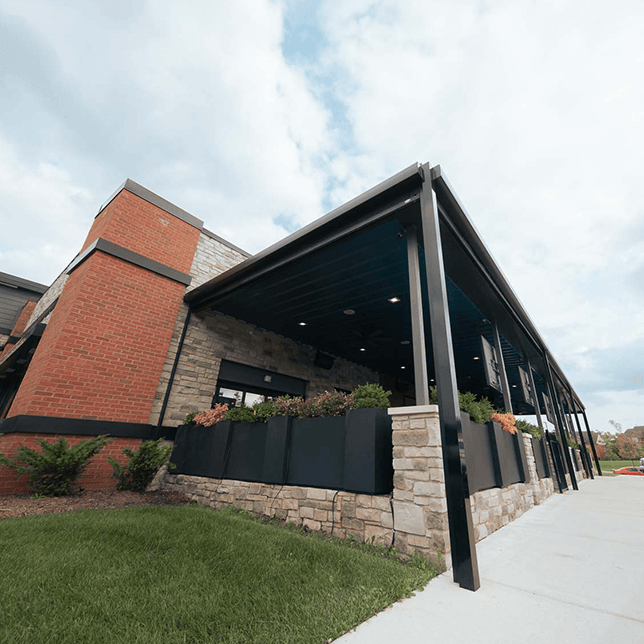 restaurant patio enclosed with MagnaTrack vinyl screens in Northville Township Michigan