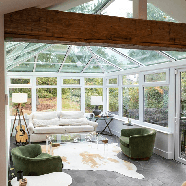 Edwardian style conservatory filled with natural light and seating area