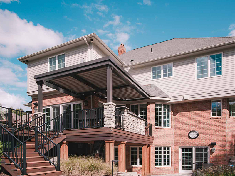 an aluminum louvered pergola on an elevated deck in Northville Michigan