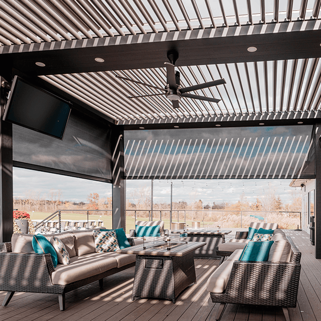 MagnaTrack screens enclosing outdoor seating area at golf club