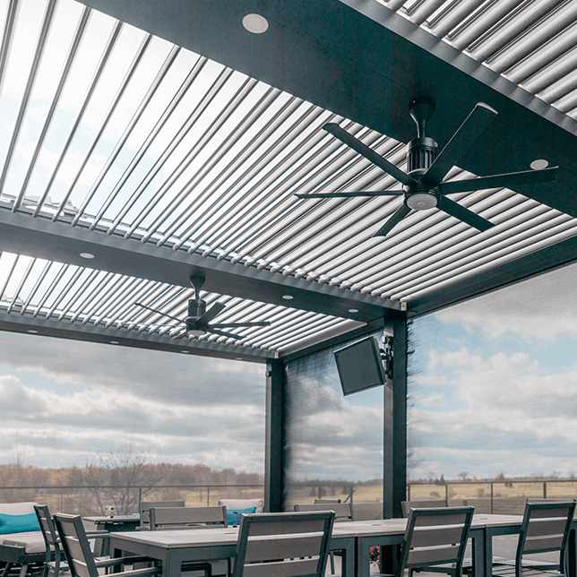 MagnaTrack screens enclosing outdoor seating area at golf club