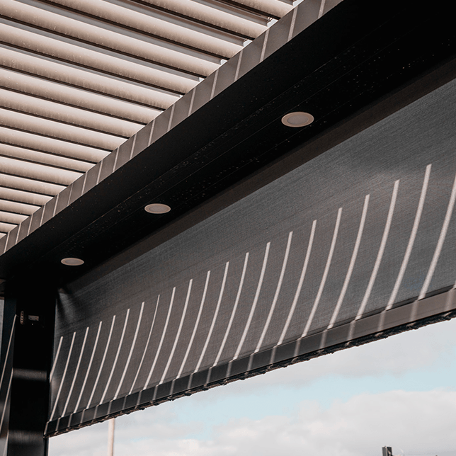large deck with pergola and screens protecting from wind