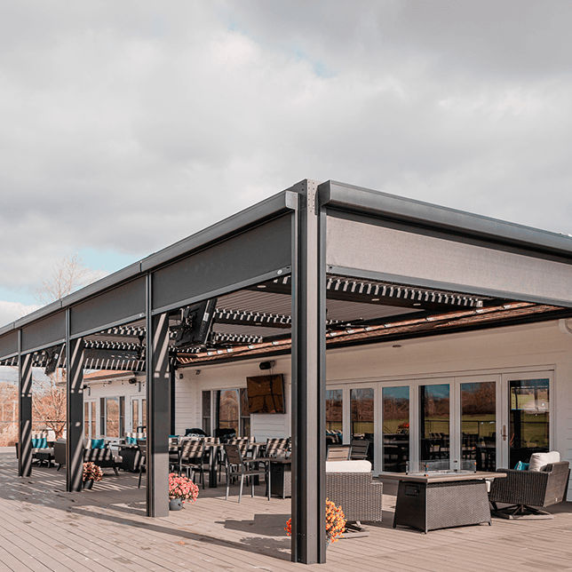 StruXure pergola with MagnaTrack screens on golf club deck in Ann Arbor Michigan