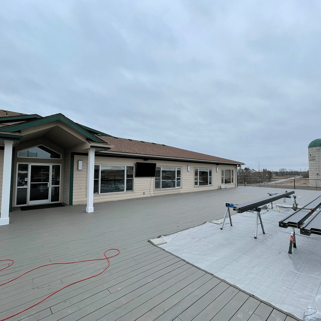 open golf club deck exposed to wind before pergola installation in Ann Arbor Michigan