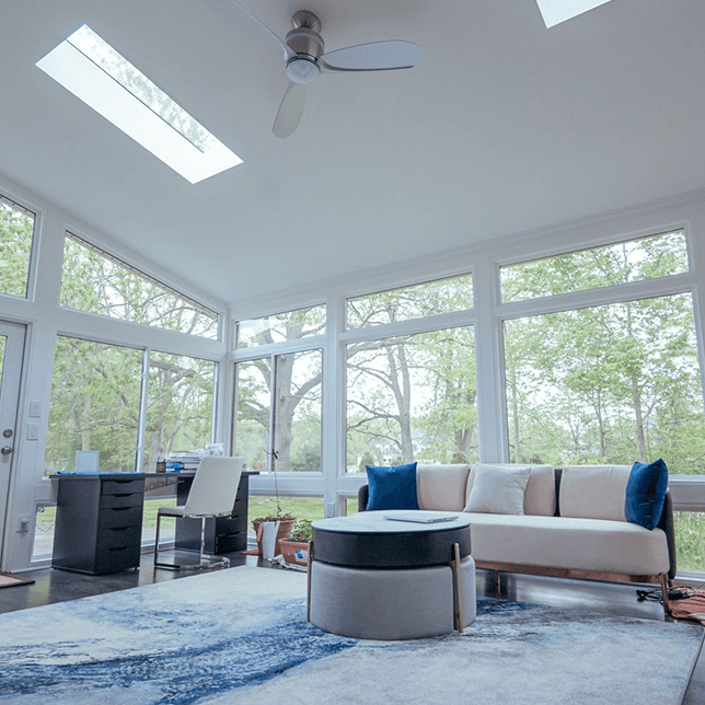 custom white sunroom addition overlooking backyard ann arbor