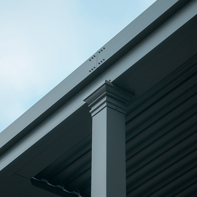 custom louvered pergola integrated into home roofline