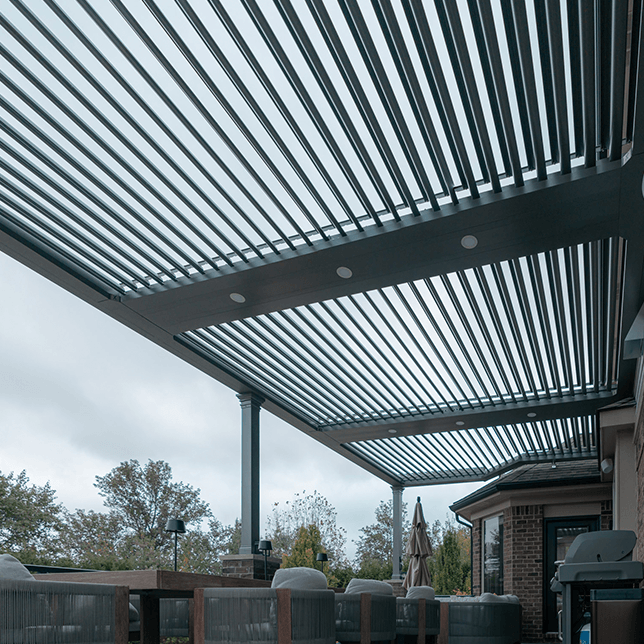 custom louvered pergola integrated into home roofline