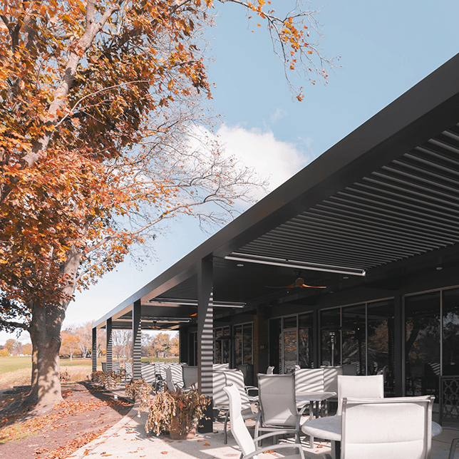 country club patio with StruXure pergola and outdoor dining