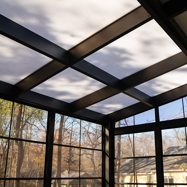 Custom pergola-style structure in forest setting